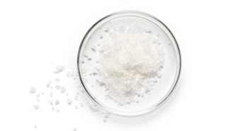 Visual representation from Mary Kay of glycolic acid as white powder in a clear dish