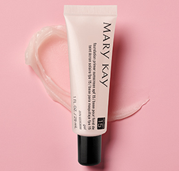 Mary Kay Foundation Primer With SPF 15 on a pink background with a translucent smear of the primer