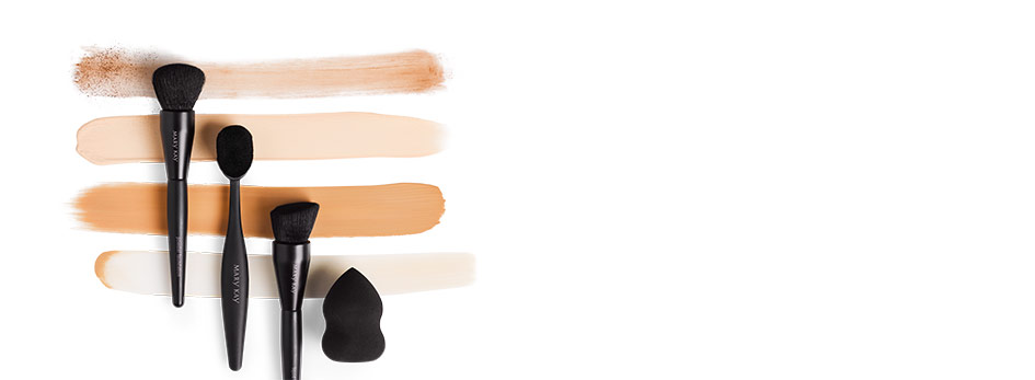 Swatches of foundation with brushes and the blending sponge.
