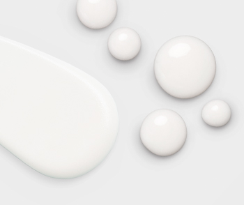 Several dots of the white Calm + Restore Facial Milk from the Clinical Solutions® Retinol 0.5 Set