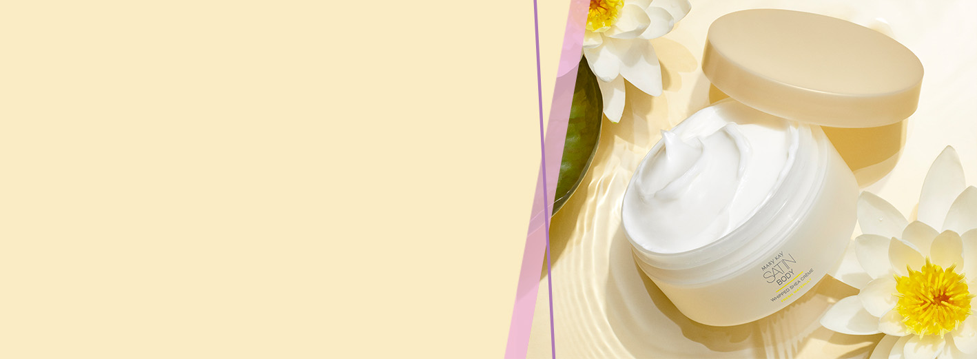 Open jar of Limited-Edition Fresh Waterlily Satin Body Whipped Shea Crème styled with white flowers