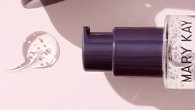 An open TimeWise Nighttime Recovery next to a dime-sized dollop of product on a light pink background