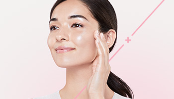 Mary Kay Model touching her face.