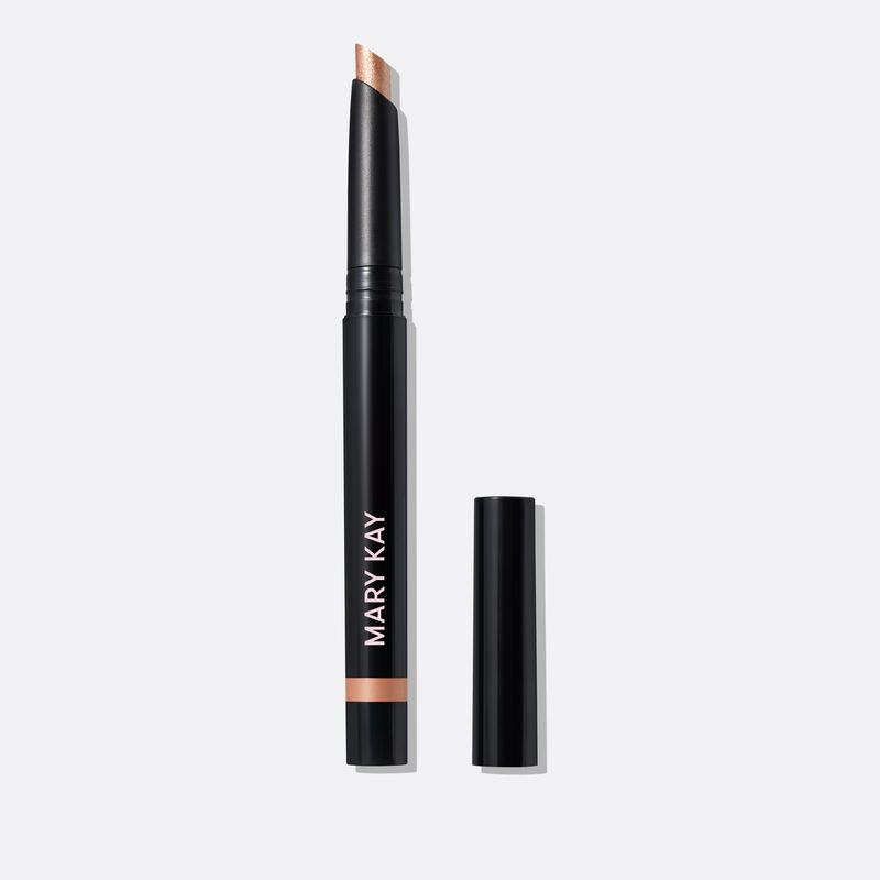 The Shimmer Eye Shadow Stick in shade Golden Sunrise stands on a white background with the cap off.&nbsp;&nbsp;