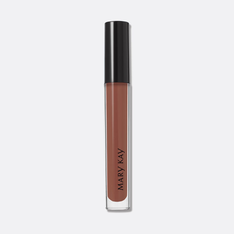 Closed tube of Mary Kay Unlimited Lip Gloss in shade Tawny Nude standing against a Grey background