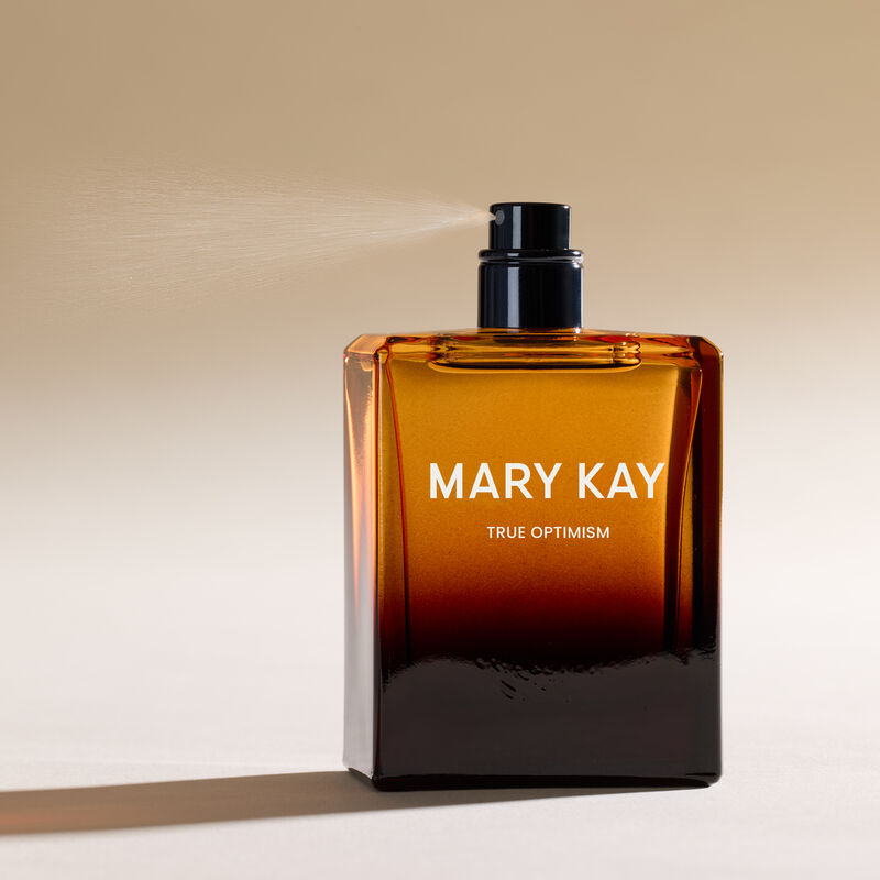 Mary Kay True Optimism Eau de Parfum spritzing against white background 