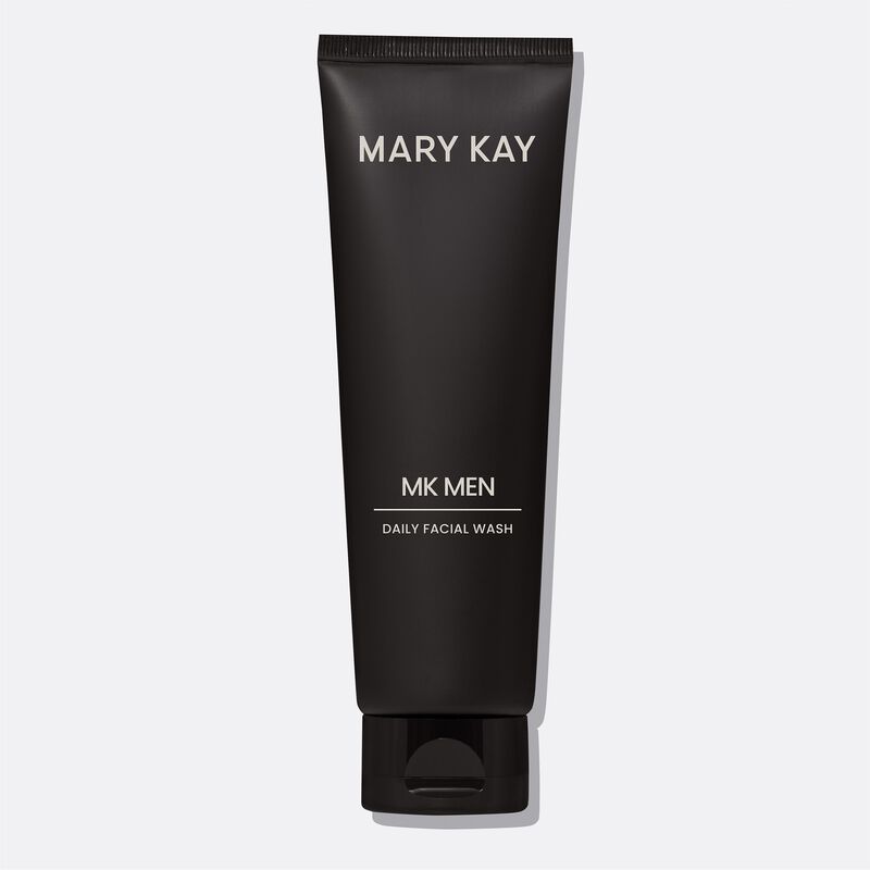 Bottle of MKMen Daily Facial Wash standing on its cap against a plain background