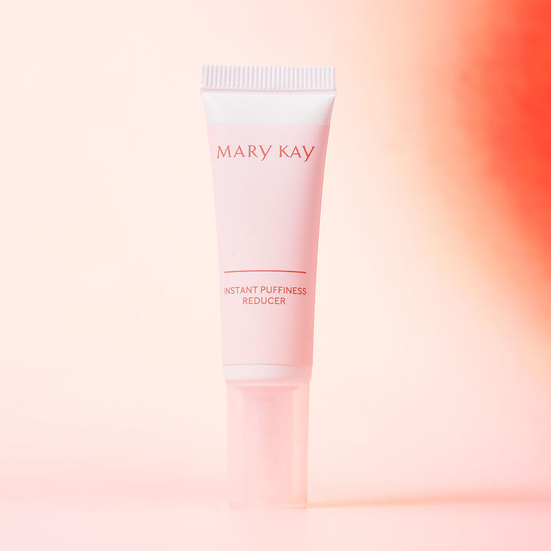 Closed tube of Mary Kay Instant Puffiness Reducer on gradient background