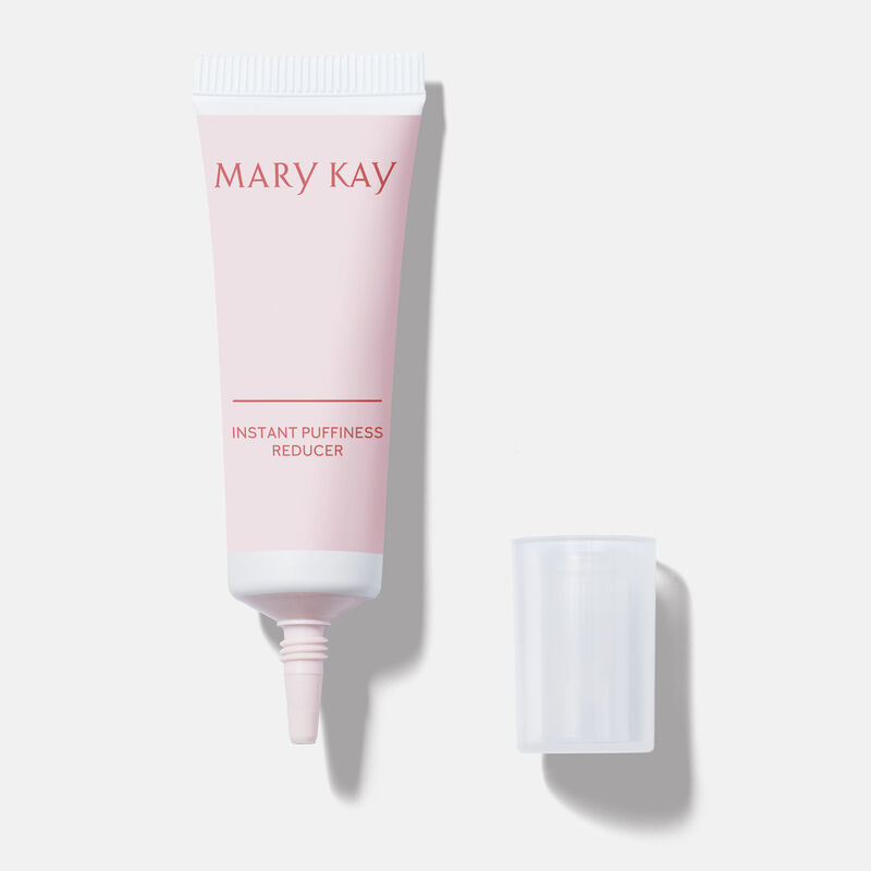 Open tube of Mary Kay Instant Puffiness Reducer with accompanying cap