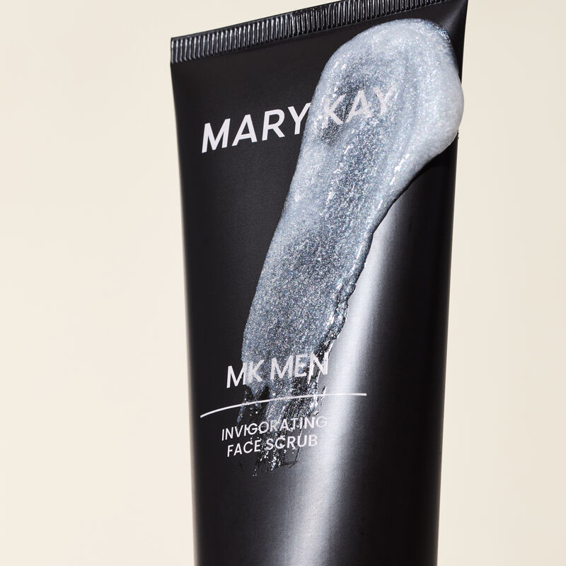Limitededition MKMen Invigorating Face Scrub tube with swipe of product across showcasing the formula and texture