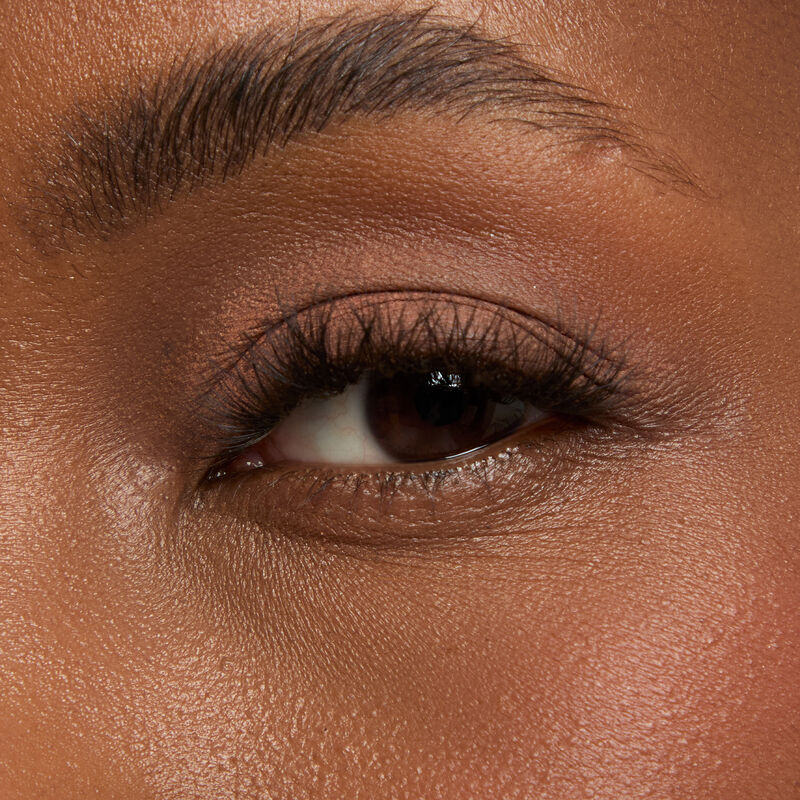 Macro eye shotnbspof Mary KaynbspMattenbspEye Shadow Stick in Celestial Nude onnbspdeepnbspskin tonenbsp