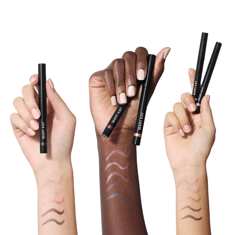 Three wrists in light, deep and medium skin tones display swatches of all five Mary Kay Shimmer Eye Shadow Sticks, highlighting color.