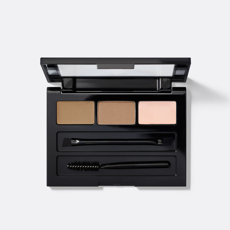 An open compact of limited-edition Mary Kay Brow Kit in shade Blonde against plain background