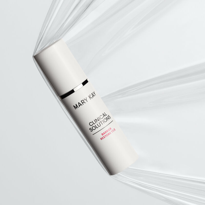 Bottle of Mary Kay Clinical Solutions Barrier Restore 1:1:3 suspended in a sheet of plastic representing a strong skin barrier