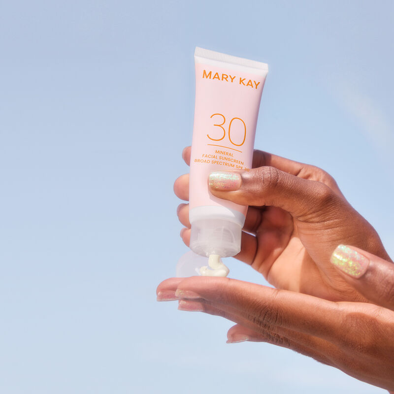 Mary Kay Mineral Facial Sunscreen in a clear purse