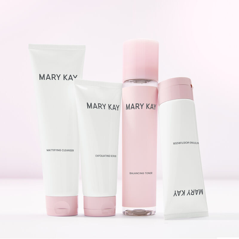 Entire line of Mary Kay Skin Care featuring a complete mattifying routine standing against light pink background