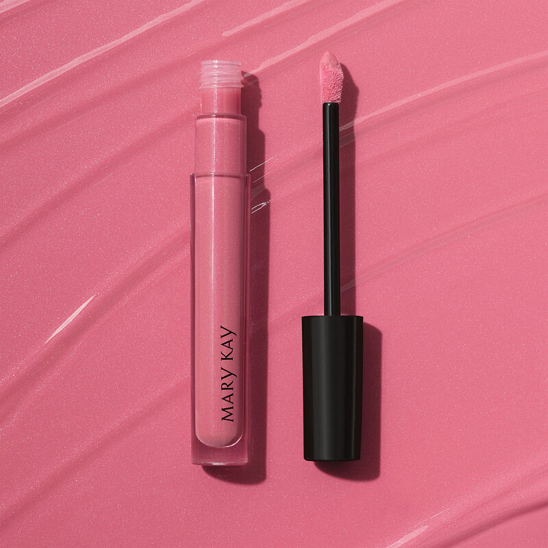 Open tube of Mary Kay Unlimited Lip Gloss in shade Pink Ballerina against accompanying shade rub