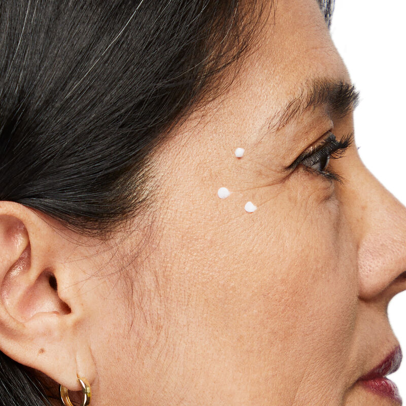 Closeup image of Dynamic Wrinkle Limiter placed in dots along extended crows feet of mature brunette woman