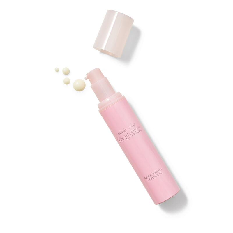 TimeWise Replenishing Serum CE being held by a model