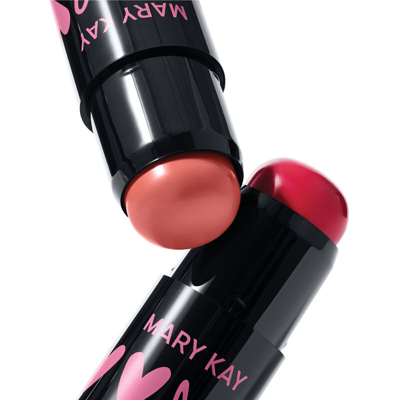 limited-edition Mary Kay Blush Sticks in Kind Spirit and Spark Change shades with black tubes, pink lettering, displayed on a white background.