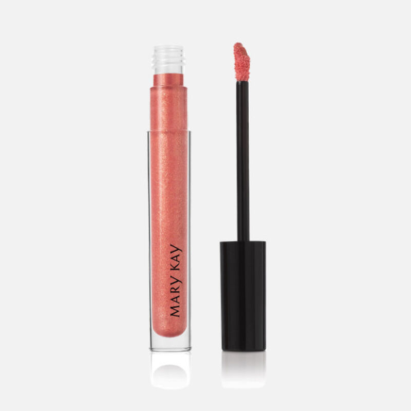 Open tube of Mary Kay Unlimited Lip Gloss in shade Fancy Nancy with accompanying applicator