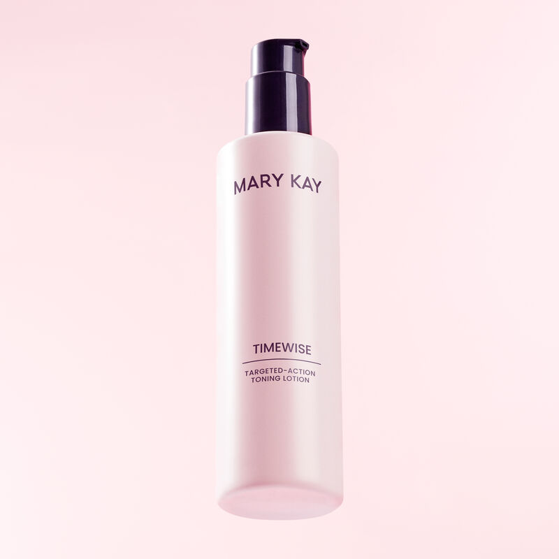 Bottle of TimeWise TargetedAction Toning Lotion standing heroically against pink background