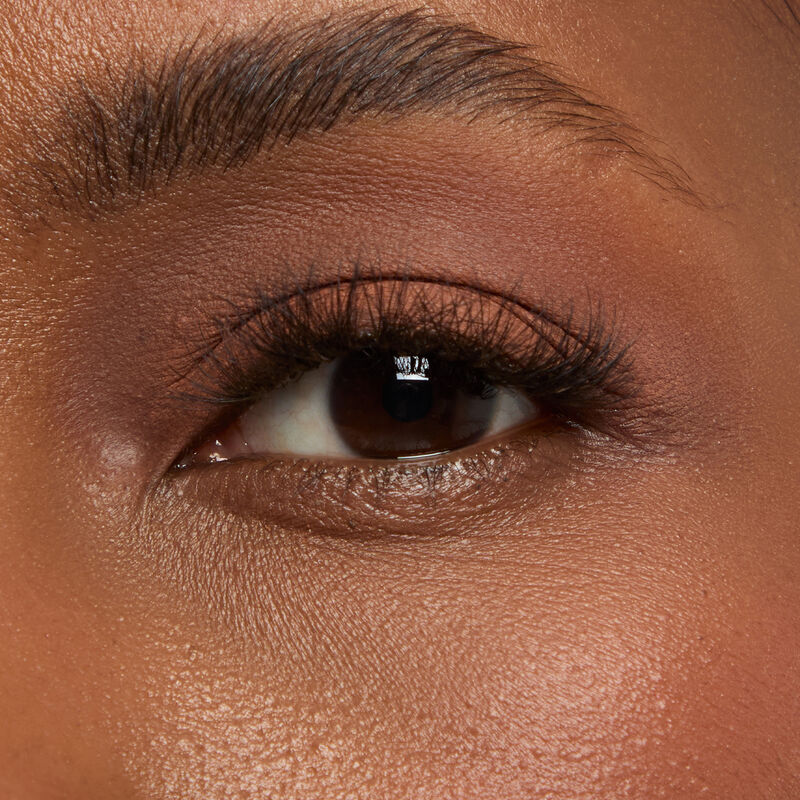 Macro eye shot of Mary Kay MatteEye Shadow Stick in Orbit Clay on deep skin tone