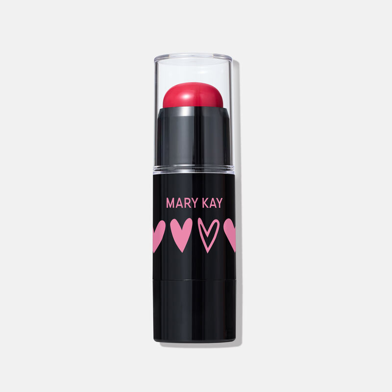 Limited-edition Mary Kay Blush Stick in Spark Change shade, featuring a red cream blush in a sleek black tube with pink heart designs and a clear cap.