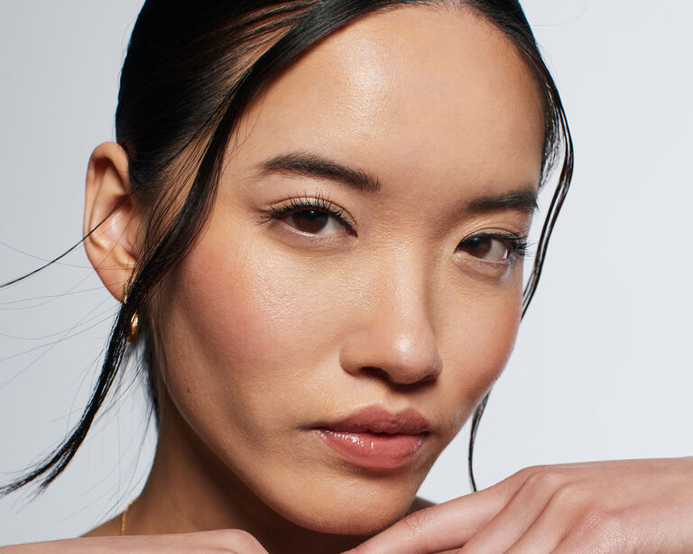 Close-up of model posing with underpainted makeup