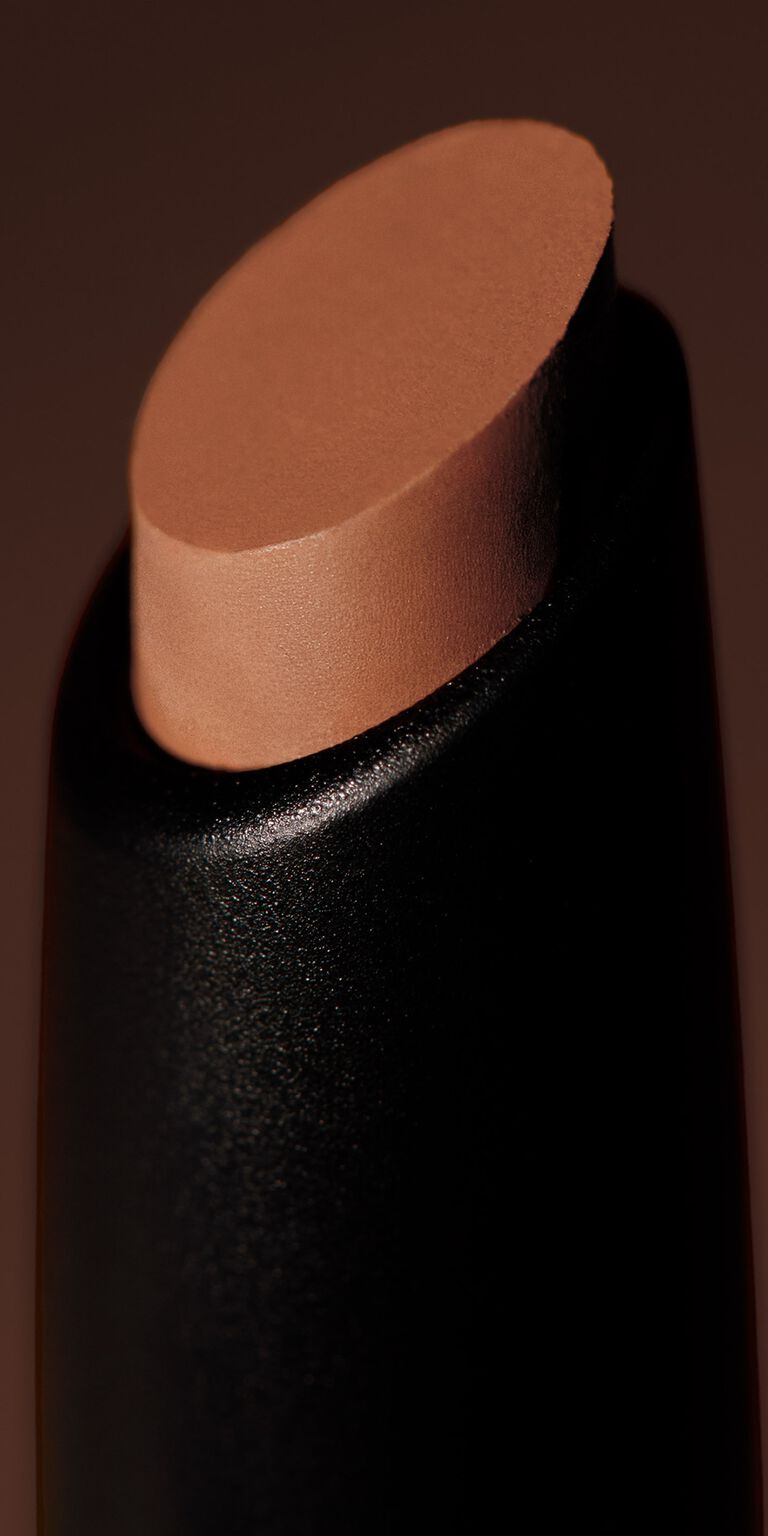 Close-up of brown matte eye shadow stick tip