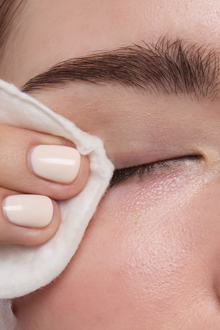 Model removing eye makeup using Mary Kay Oil Free Eye Makeup Remover