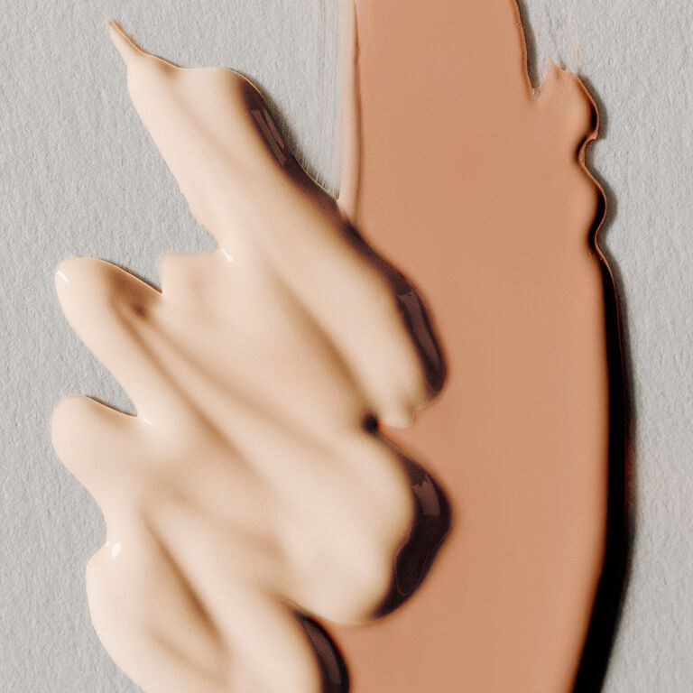 Product swatch featuring light shades of liquid foundation and concealer