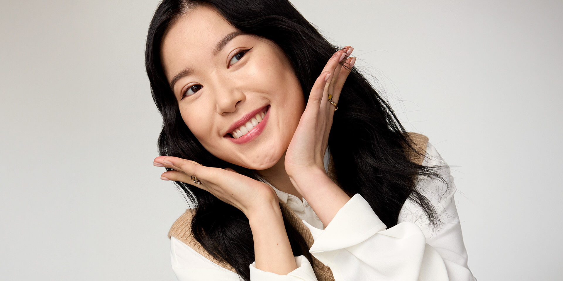 Woman looking sideways and laughing