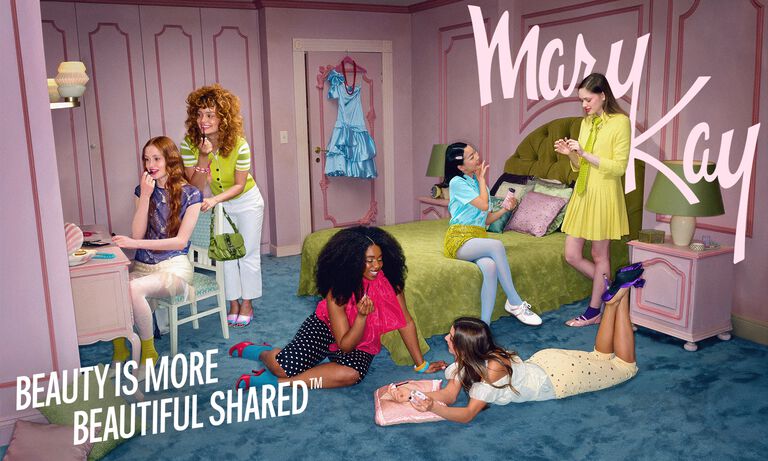 Group of women getting ready together in a bedroom