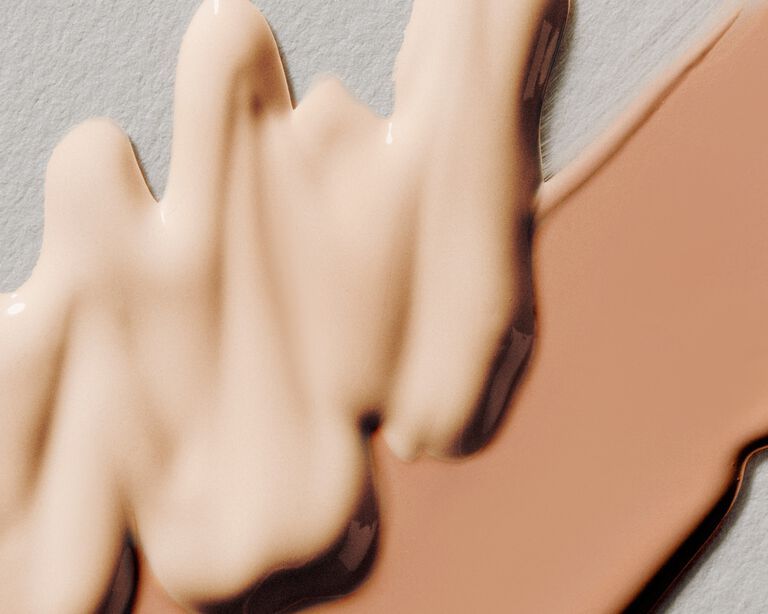 Product swatch featuring a light shade of liquid foundation and cream concealer 
