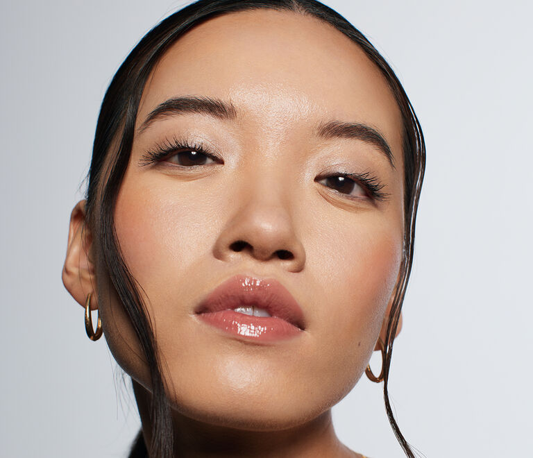 Brunette model posing with underpainted makeup