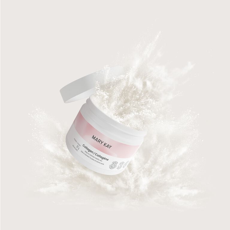 Mary Kay collagen bursting through white powder on a plain light background.