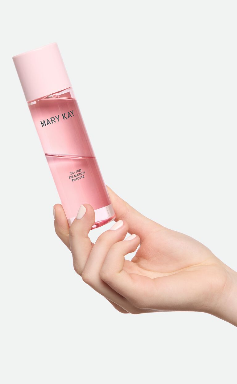 Model holding Mary Kay Oil Free Eye Makeup Remover