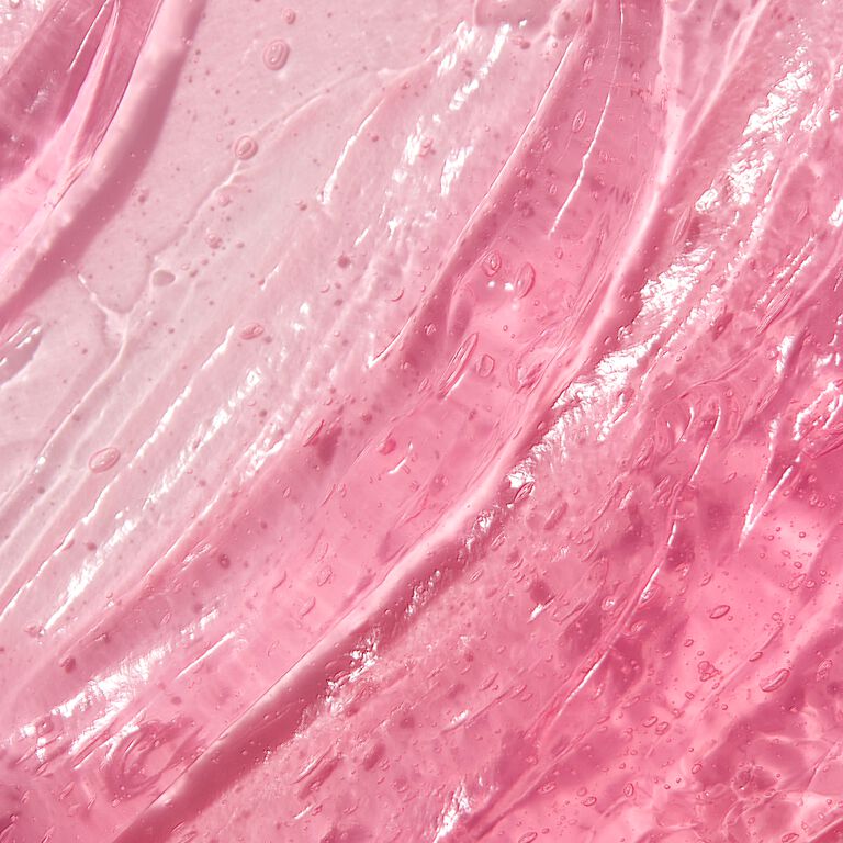 Close-up of pink collagen moisturizing gel smear