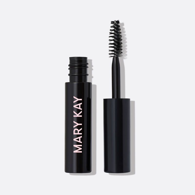 Open tube of Mary Kay Clear Brow Styling Gel with accompanying wand standing against plain background