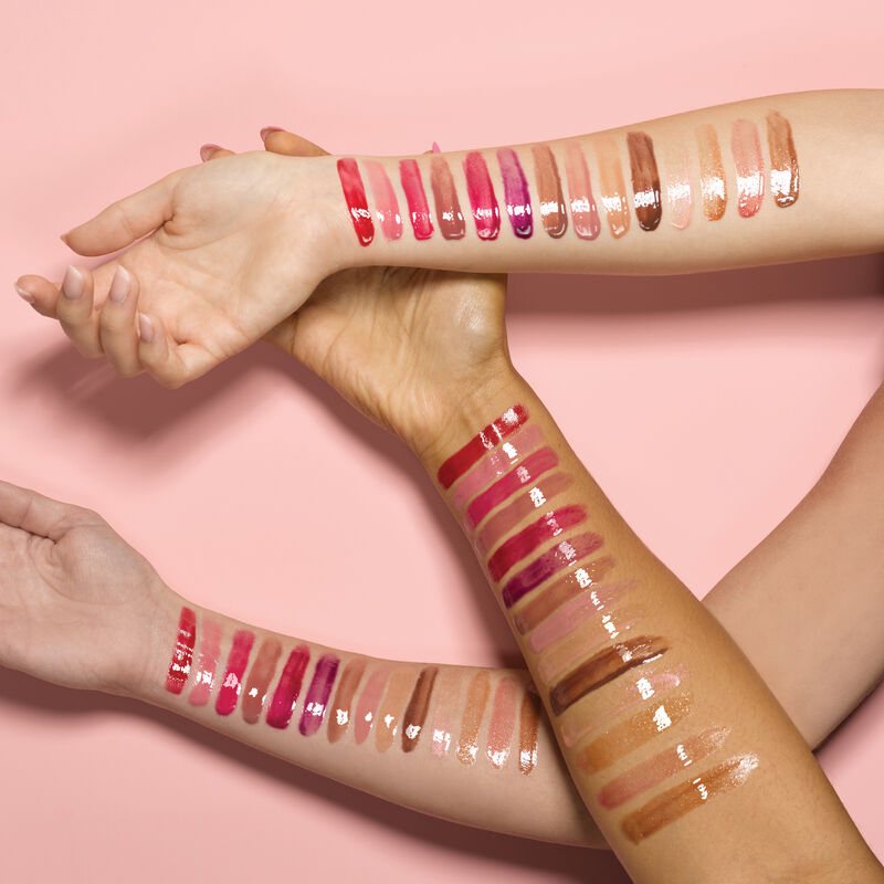 Arm swatches on ivory, bronze and deep skin tones of all shades of Mary Kay Unlimited Lip Gloss.