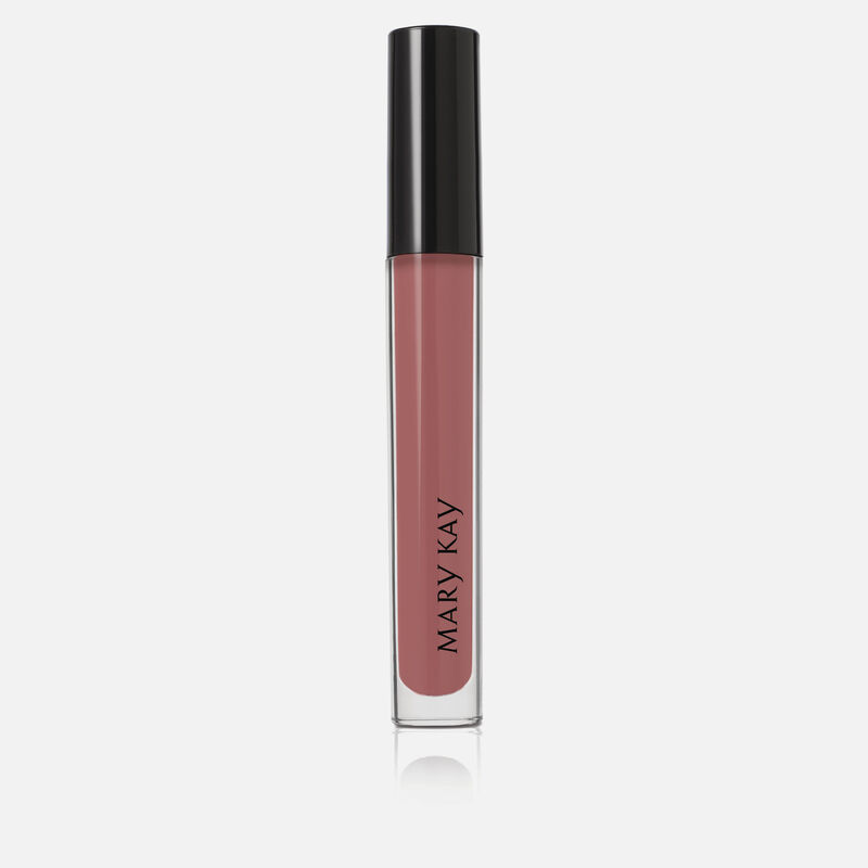 Closed tube of Mary Kay Unlimited Lip Gloss in shade Nude Blush standing against a white background.