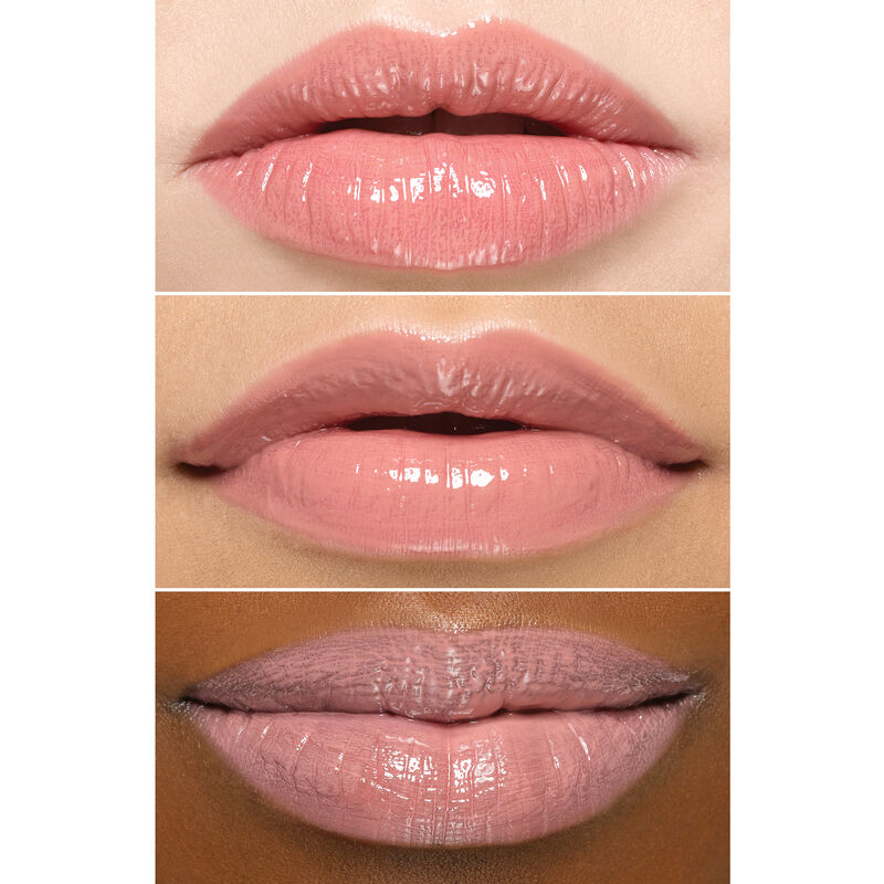 Close up of lips wearing Mary Kay Unlimited Lip Gloss in shade Nude Blush on an ivory, bronze and deep skin tone.