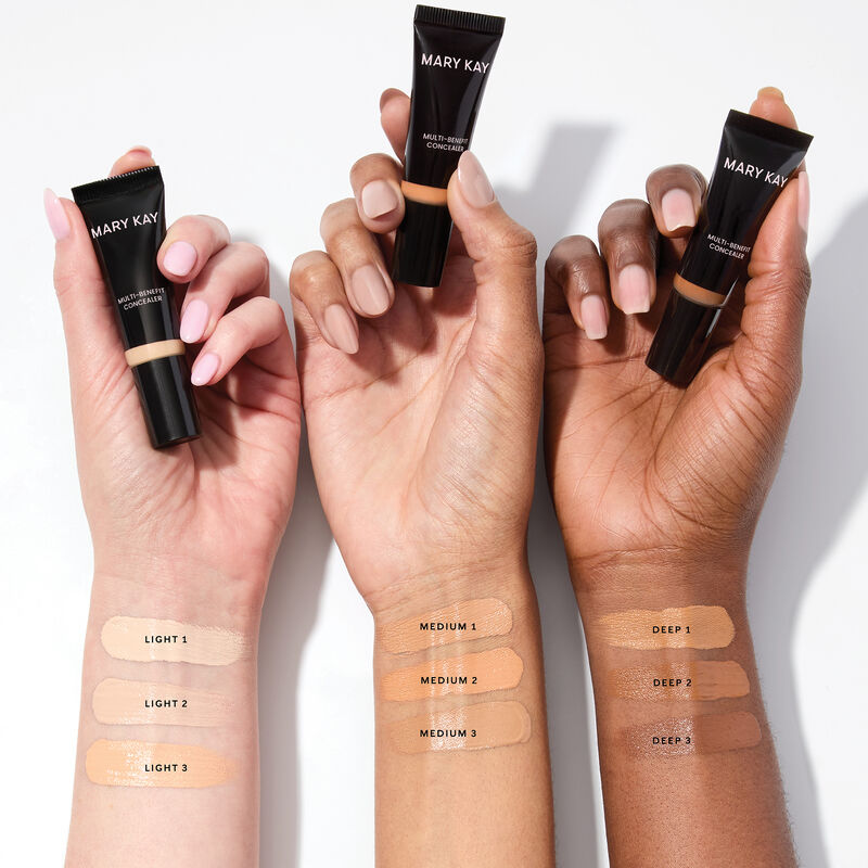 Three wrists, representing light, medium and deep skin tones, showcase the shade range for Mary Kay Multi-Benefit Concealer