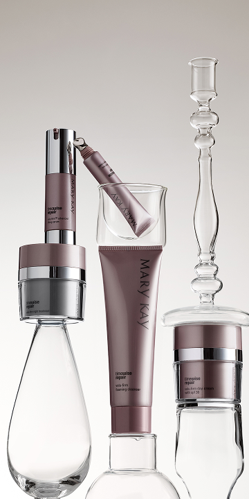 A close up of a woman's face with eye cream.