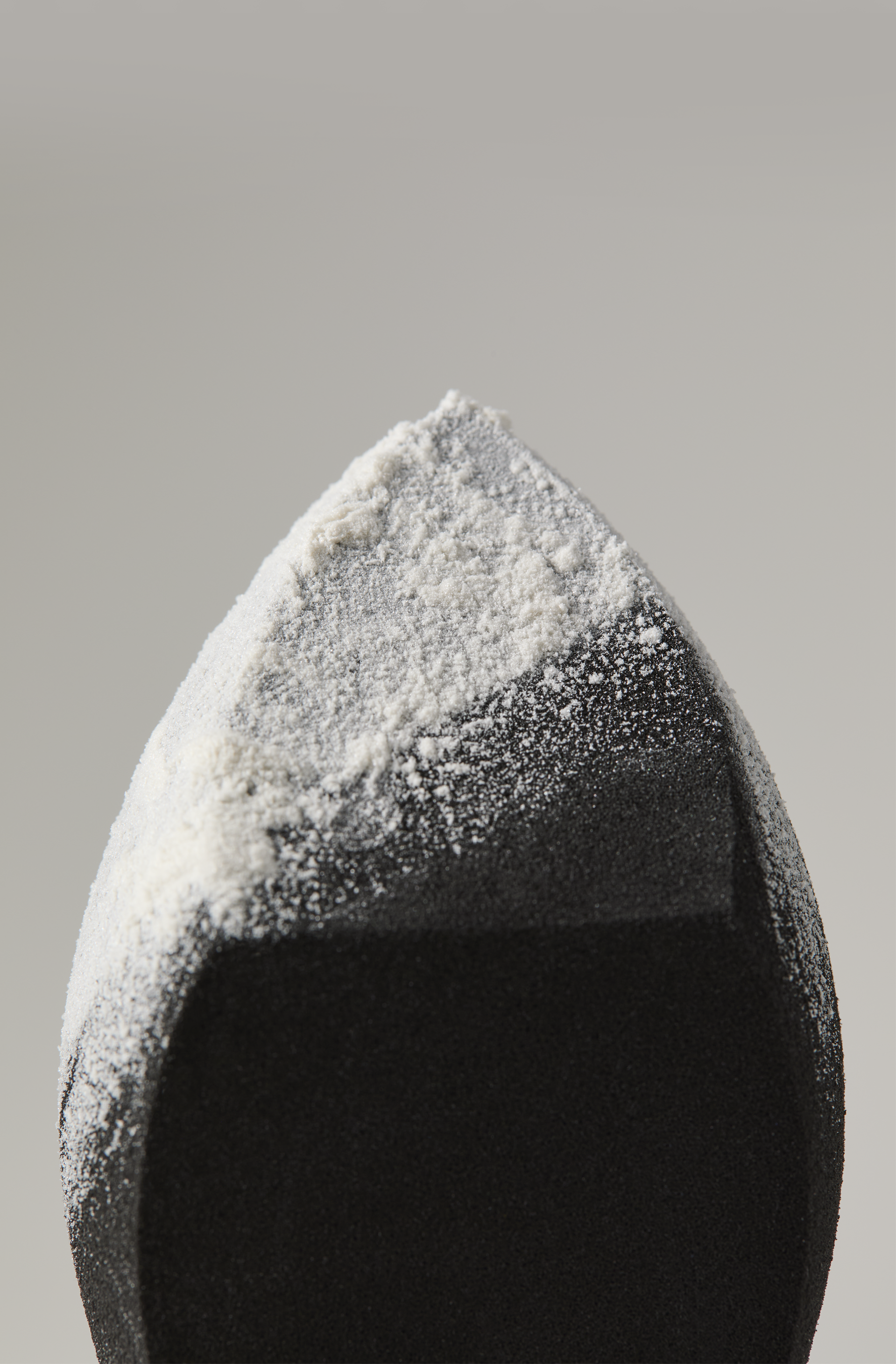 Mary Kay Even Complexion Makeup Sponge covered in Mary Kay Translucent Loose Powder