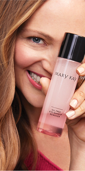 Model holding Mary Kay Oil Free Eye Makeup Remover over her eye