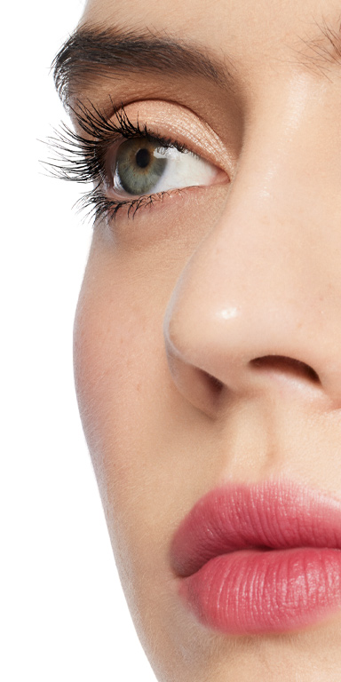 Profile view of model's eyelashes after 3 coats of Mary Kay Great Heights Mascara